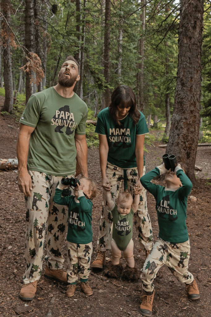 Family in the forest with Squatch theme matching pajamas
